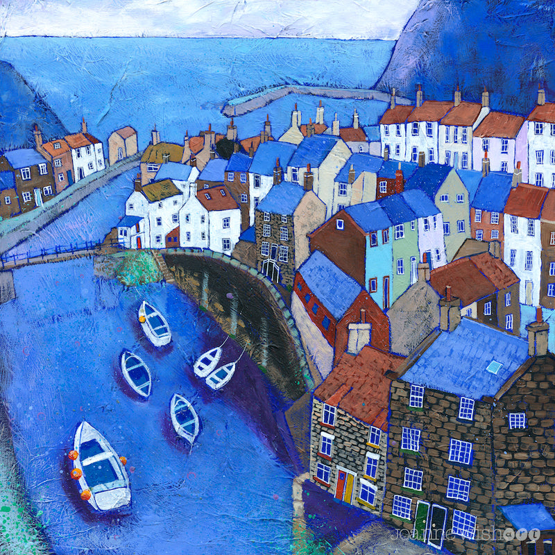 A print of Staithes village featuring topsy turvy houses on the cliffside with the boat filled beck leading out to sea. 