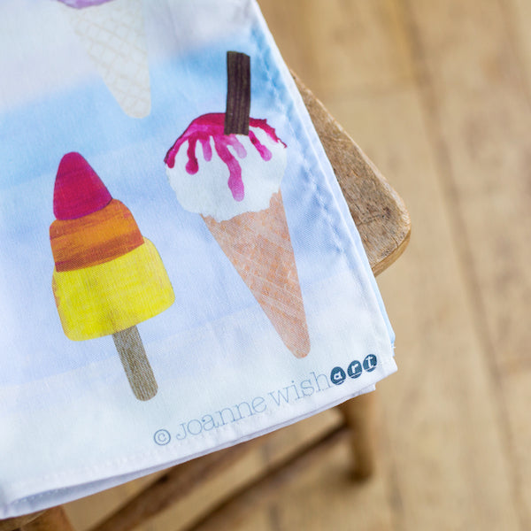 a detail shot of the corner of a tea towel featuring a rocket lolly.
