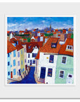 A mounted print of Whitby rooftops.