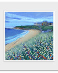 A mounted print of Tynemouth longhands featuring the grand hotel as seen from the dunes. Bright orange berries sway in the grasses. 