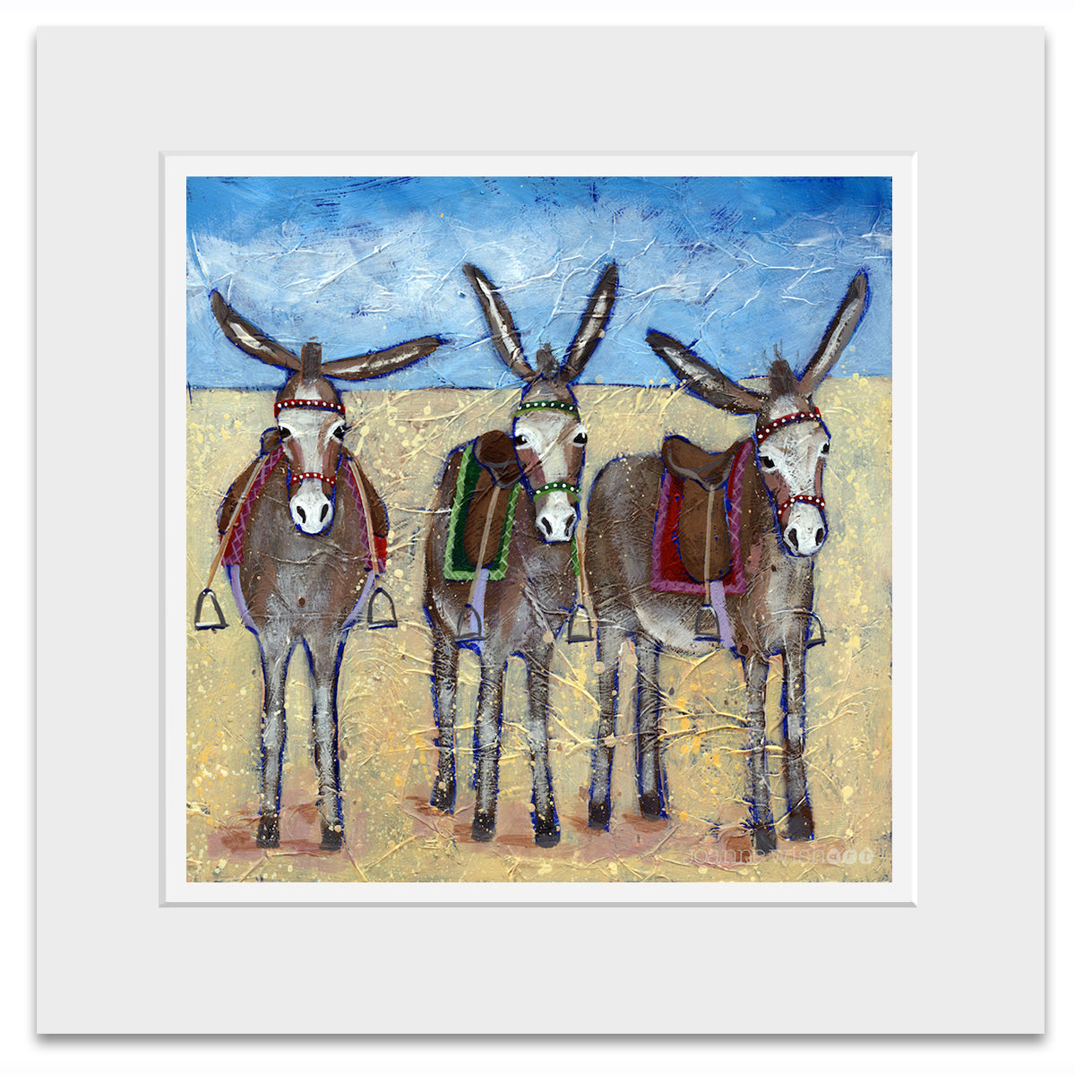 A mounted print of three cute donkeys lined up in row on the beach.